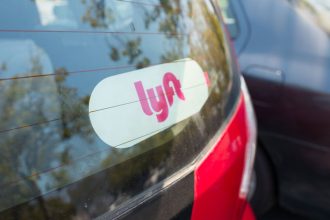 Sticker for Lyft on the back of a Lyft ride sharing vehicle in the Silicon Valley town of Santa Clara, California, August 17, 2017. (Photo via Smith Collection/Gado/Getty Images).